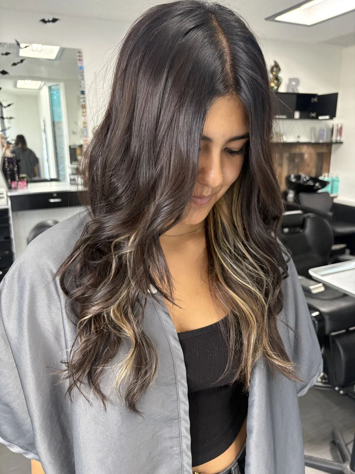 Brunette with face-framing highlights